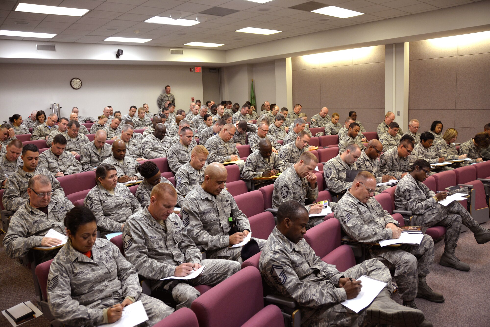 U.S. Air Force Airmen and Army Soldiers from the North Carolina National Guard write down all the roles they each fill in their lives as part of an exercise while attending a Four Lenses & Enhanced Human Capital course held at the North Carolina Air National Guard Base, Charlotte Douglas International Airport, Dec. 11, 2015. Attendees learned better ways to communicate, not only as supervisors but how to strengthen communication and personal interaction with coworkers, family and friends during the day-long professional development training. (U.S. Air National Guard photo by Master Sgt. Patricia F. Moran /Released)
