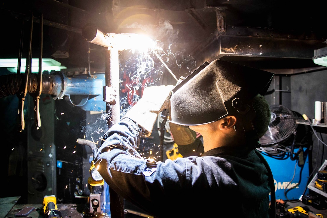 Navy Seaman Kaleb Weese practices welding aboard the aircraft carrier USS George Washington in Norfolk, Va., Dec. 15, 2015. U.S. Navy photo by Petty Officer 2nd Class Jonathan Nelson