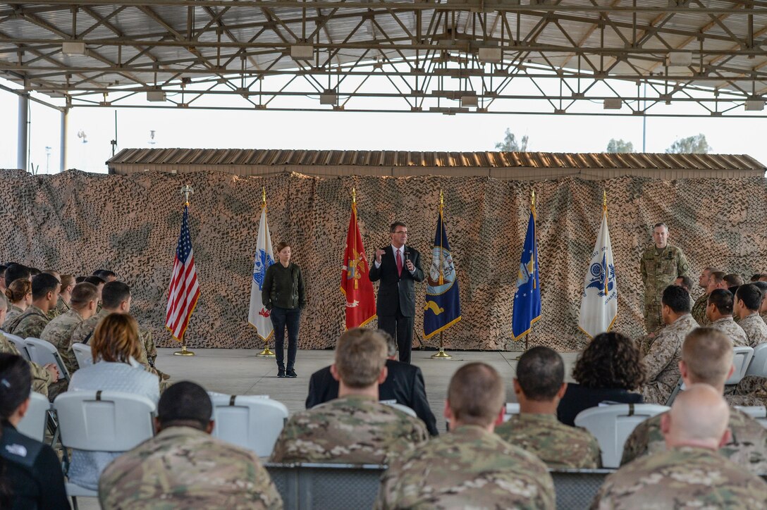 U.S. Defense Secretary Ash Carter, his wife, Stephanie, and Army Lt. Gen. Sean MacFarland speak with troops in Baghdad, Dec. 16, 2015. Carter thanked the troops for their service and sacrifice, especially during the holiday season. MacFarland is in charge of the coalition fighting the Islamic State of Iraq and the Levant, or ISIL. DoD photo by Army Sgt. 1st Class Clydell Kinchen