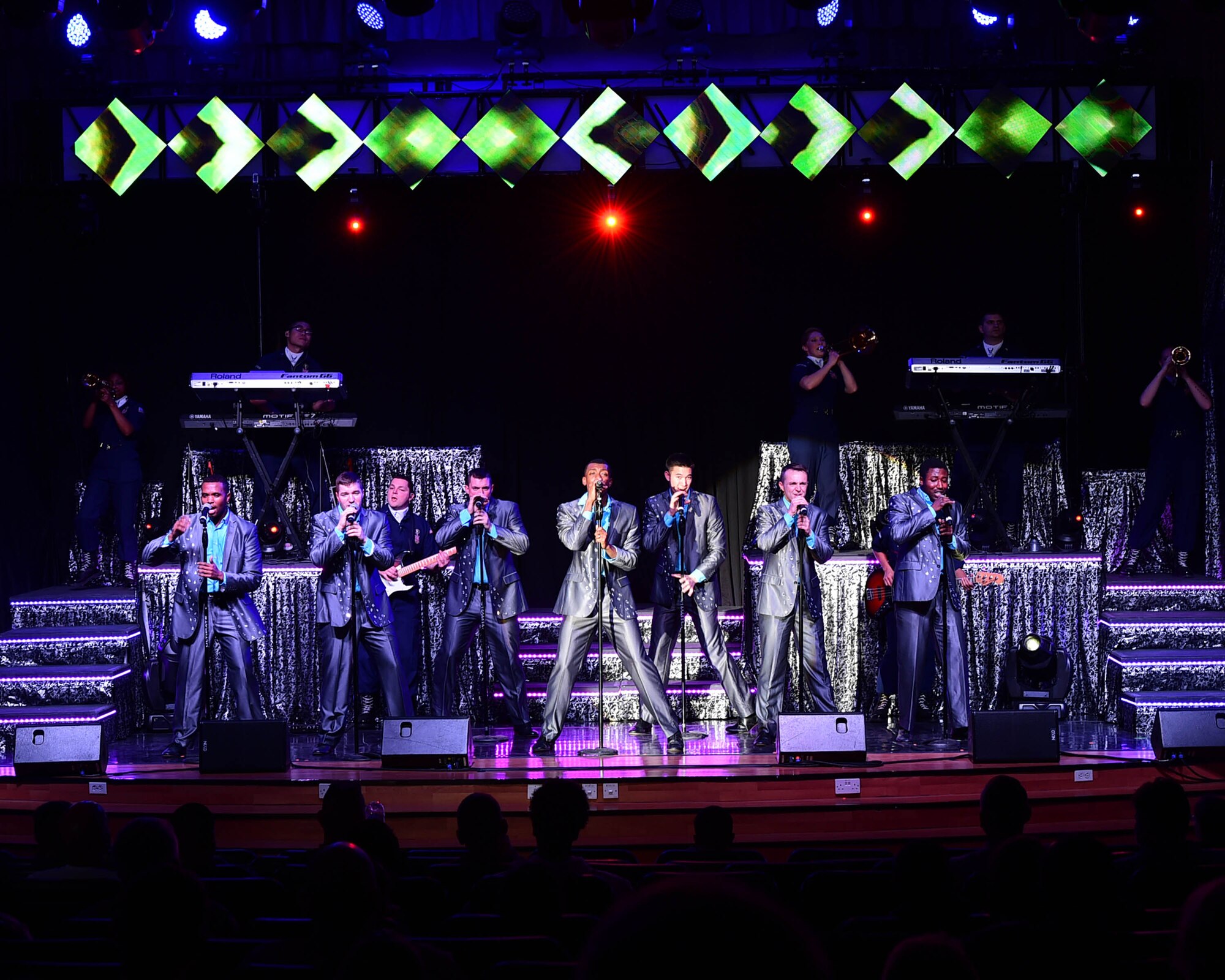Tops in Blue members perform during a recent visit to the 386th Air Expeditionary Wing at an undisclosed location in Southwest Asia, Dec. 16, 2015. Tops In Blue is an all active- duty Air Force expeditionary entertainment group that travels worldwide to entertain military personnel and their families, raising morale and educating audiences on topics such as resiliency and social issues through musical performances. Their seven-month tour includes 75 performances in more than 20 countries. (U.S. Air Force photo by Staff Sgt. Jerilyn Quintanilla)