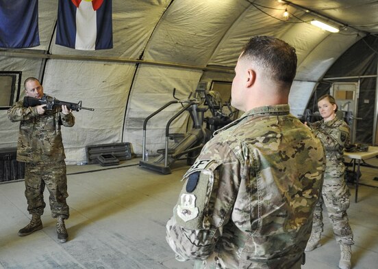 Tech. Sgt. Jason Nicholson, 455th Expeditionary Security Forces Squadron Check Six instructor for Afghanistan, practices reaction drills with a Check Six class at Bagram Airfield, Afghanistan Dec. 3, 2015. Since the training was implemented two years ago, no active shooter incident involving Airmen has taken place in the Afghanistan area of responsibility.  (U.S. Air Force photo by Tech. Sgt. Nicholas Rau)
