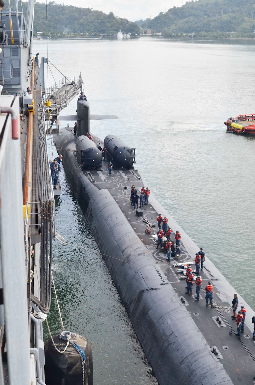 151114-N-VH871-121 SEPANGGAR, Malaysia (Nov. 14, 2015) The guided-missile submarine USS Ohio (SSGN 726) moors alongside the submarine tender USS Emory S. Land (AS 39). Emory S. Land's and Ohio's visit to Malaysia continues the U.S. Navy's ongoing commitment to theater security, cooperation and friendship with local partner navies. Emory S. Land is a forward deployed expeditionary submarine tender on an extended deployment conducting coordinated tended moorings and afloat maintenance in the U.S. 5th and 7th Fleet areas of operations. (U.S. Navy photo by Mass Communication Specialist Seaman Austin L. Ingram/Released)