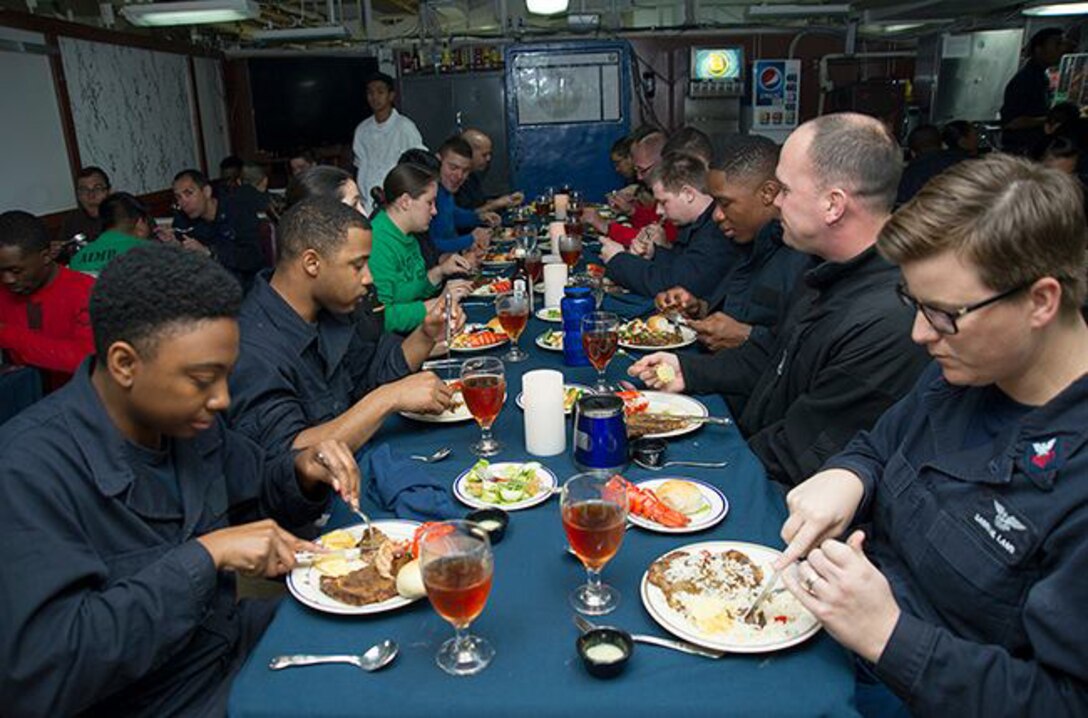 Sailors enjoy a meal during the October birthday celebration lunch aboard USS George Washington. DLA delivered more than a million pounds of food to three South American countries for the GW to resupply during its voyage from San Diego to Norfolk, Virginia. 