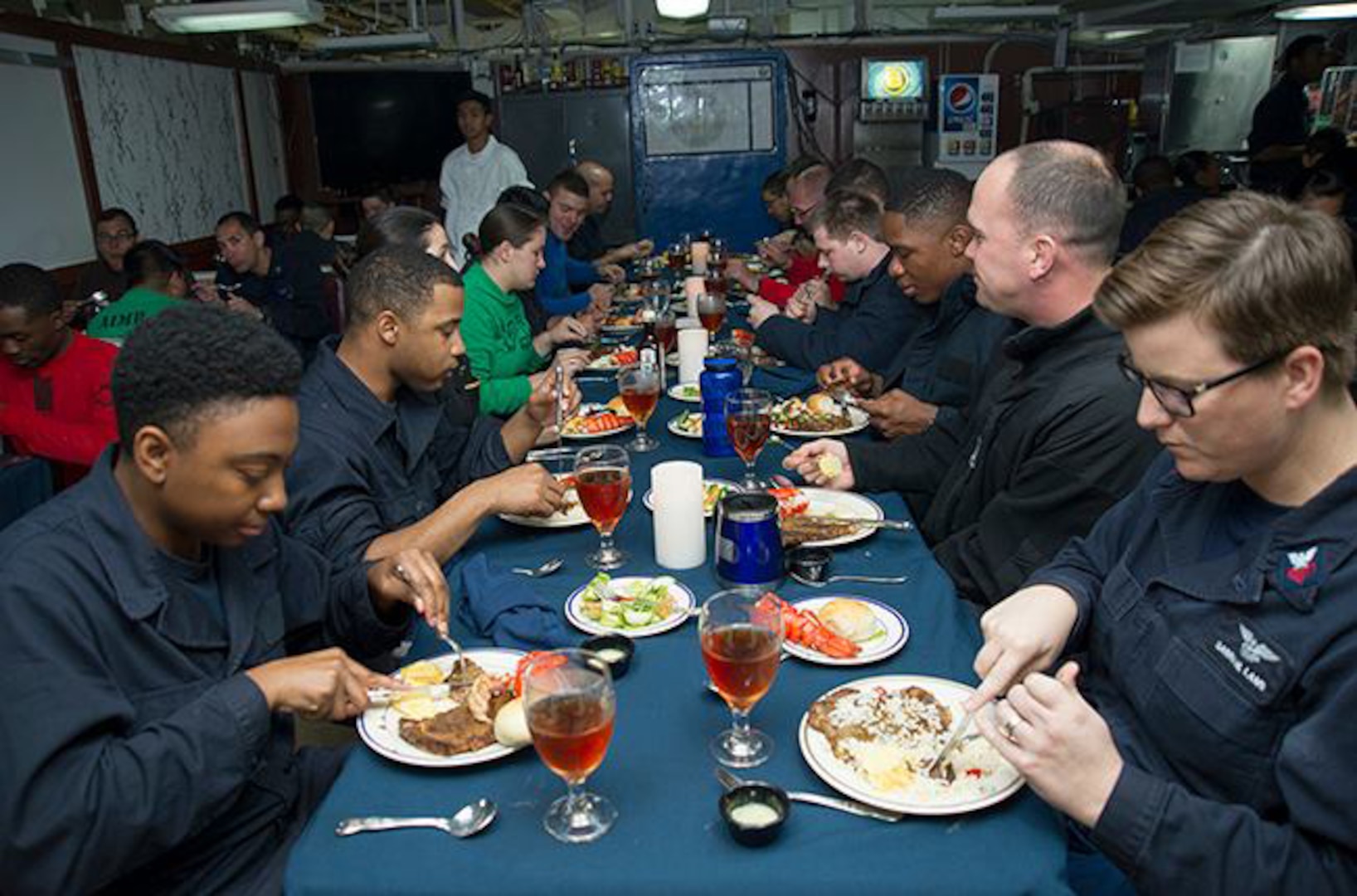 Sailors enjoy a meal during the October birthday celebration lunch aboard USS George Washington. DLA delivered more than a million pounds of food to three South American countries for the GW to resupply during its voyage from San Diego to Norfolk, Virginia. 