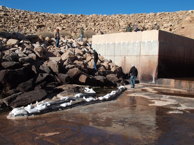 Savannah district’s risk cadre members and Risk Management Center staff inspect the Santa Rosa Dam in New Mexico for the Albuquerque District December 2013. The coalition inspected the seepage location adjacent to the dam’s spillway stilling basin during a risk assessment. 