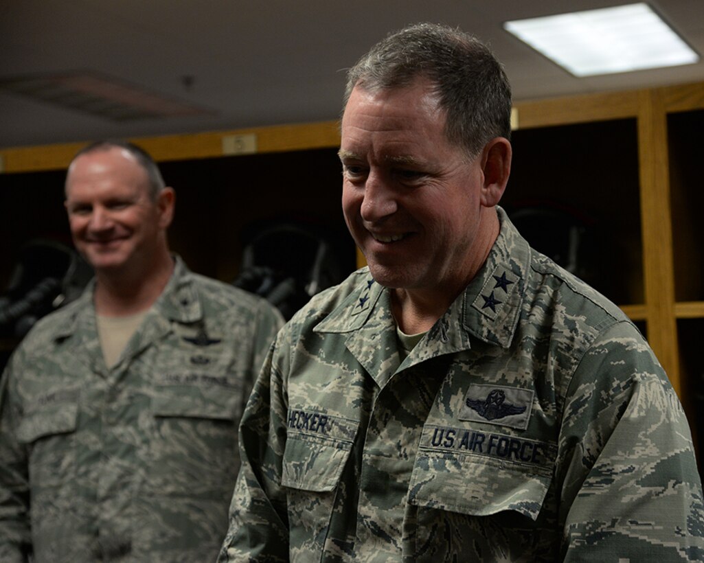 Maj. Gen. James Hecker, 19th Air Force commander, watches members of the 149th Fighter Wing’s aircrew flight equipment section demonstrate the capabilities of helmet mounted with integrated targeting technology during his visit, Dec. 10, to Joint Base San Antonio-Lackland, Texas.