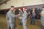 Col. Michael Gimbrone (right), 502nd Security Forces Logistics Support Group commander, delivers Christmas cookies to 502nd Civil Engineer
Squadron firefighters Dec. 11 at JBSA-Randolph.