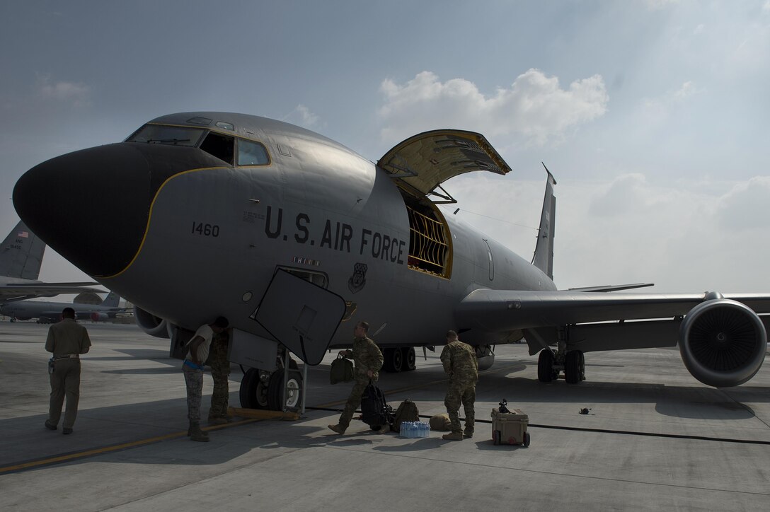 U.S. airmen board a U.S. Air Force KC-135 Stratotanker before conducting a mission in support of Operation Inherent Resolve at Al Udeid Air Base, Qatar, Dec. 4, 2015. The airmen are assigned to the 340th Expeditionary Air Refueling Squadron.