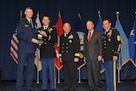 DLA Director Air Force Lt. Gen. Andy Busch presents the DLA Joint Reserve Forces Junior Officer of the Year award to Army Capt. Vince Barber at the 48th Annual DLA Employee Recognition Ceremony Dec. 10 at the McNamara Headquarters Complex in Ft. Belvoir, Va. Pictured with Busch and Barber is Land and Maritime commander Navy Rear Adm. John King, Robert A. McCullough, DLA Deputy Director J9, Joint Reserve Force, and Army Command Sgt. Maj. Charles Tobin, DLA’s senior enlisted leader.