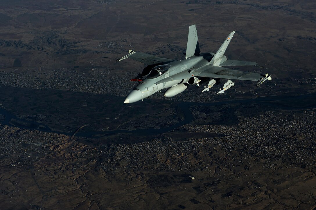 A Royal Canadian air force F-18 aircraft flies in support of Operation Inherent Resolve over Southwest Asia, Dec. 4, 2015. U.S. Air Force photo by Tech. Sgt. Nathan Lipscomb 
