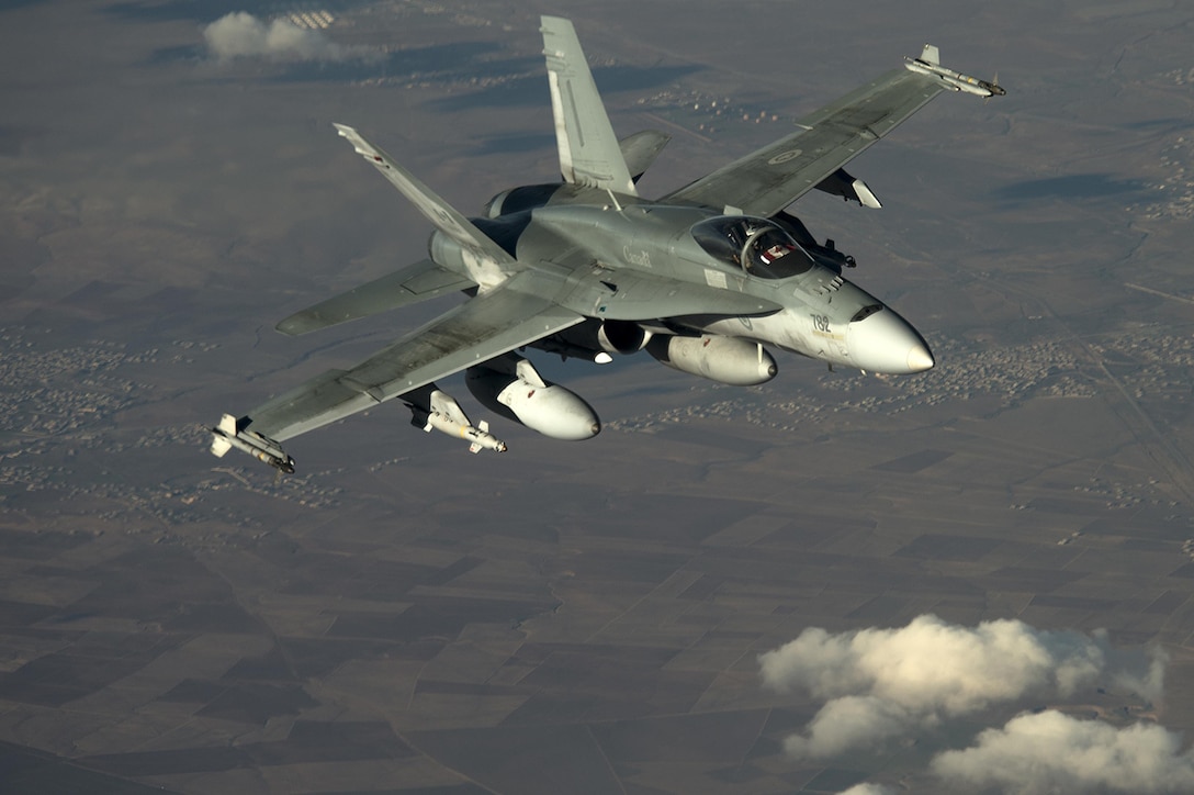 A Canadian air force F-18 aircraft flies in support of Operation Inherent Resolve over Southwest Asia, Dec. 4, 2015. U.S. Air Force photo by Tech. Sgt. Nathan Lipscomb