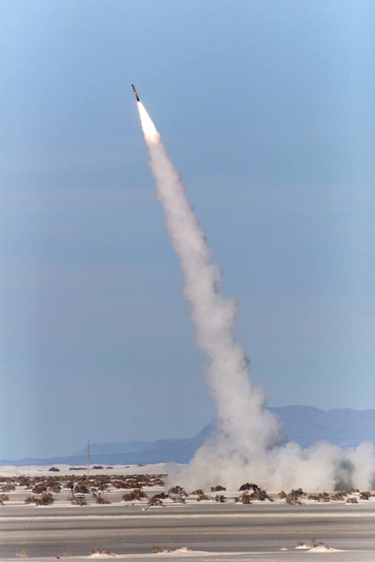 Marines with Battery D, 2nd Battalion, 14th Marine Regiment, fire an M31 Guided Multiple Launch System (GMLRS) Missile from the M142 High Mobility Artillery Rocket System (HIMARS) during a raid exercise at White Sands Missile Range, New Mexico, Dec. 4, 2015. The M31 provides Battery D with the capability to precisely strike targets over 70 kilometers away with a 200lb blast fragmentation warhead. 