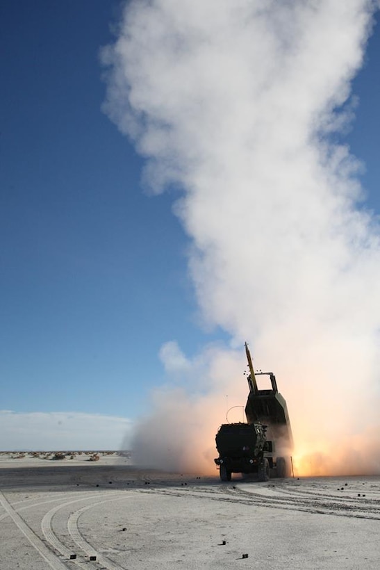 Marines with Battery D, 2nd Battalion, 14th Marine Regiment, fire an M31 Guided Multiple Launch Rocket System (GMLRS) Missile from the M142 High Mobility Artillery Rocket System (HIMARS) during a raid exercise at White Sands Missile Range, New Mexico, Dec. 4, 2015. The M31 provides Battery D with the capability to precisely strike targets over 70 kilometers away with a 200lb blast fragmentation warhead. 