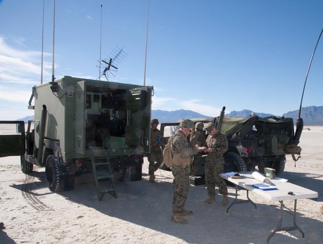 High Mobility Artillery Rocket System (HIMARS) crewmen assigned to Battery D, 2nd Battalion, 14th Marine Regiment, prepare their launcher for live-fire operations after debarking a KC-130J aircraft, supporting their raid operations at White Sands Missile Range, New Mexico, Dec. 4, 2015.