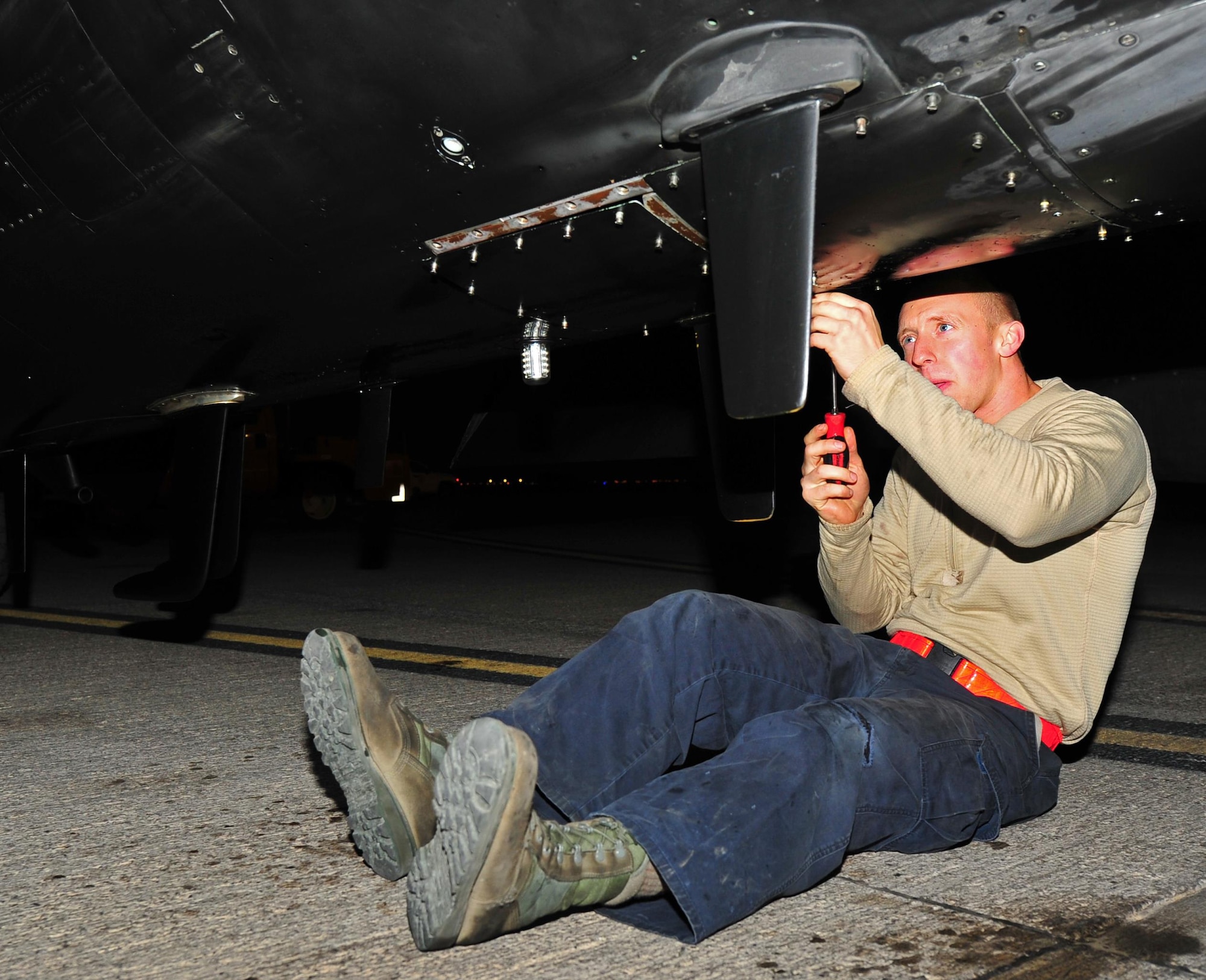 Airman 1st Class Andrew, Dragon Aircraft Maintenance Unit electrician, inspects the underside of a U-2 Dragon Lady aircraft at an undisclosed location in Southwest Asia, Dec. 7, 2015.  Maintainers inspect the U-2 prior to and directly after a combat mission to ensure everything on the aircraft is in working order. (U.S. Air Force photo by Staff Sgt. Kentavist P. Brackin/released)