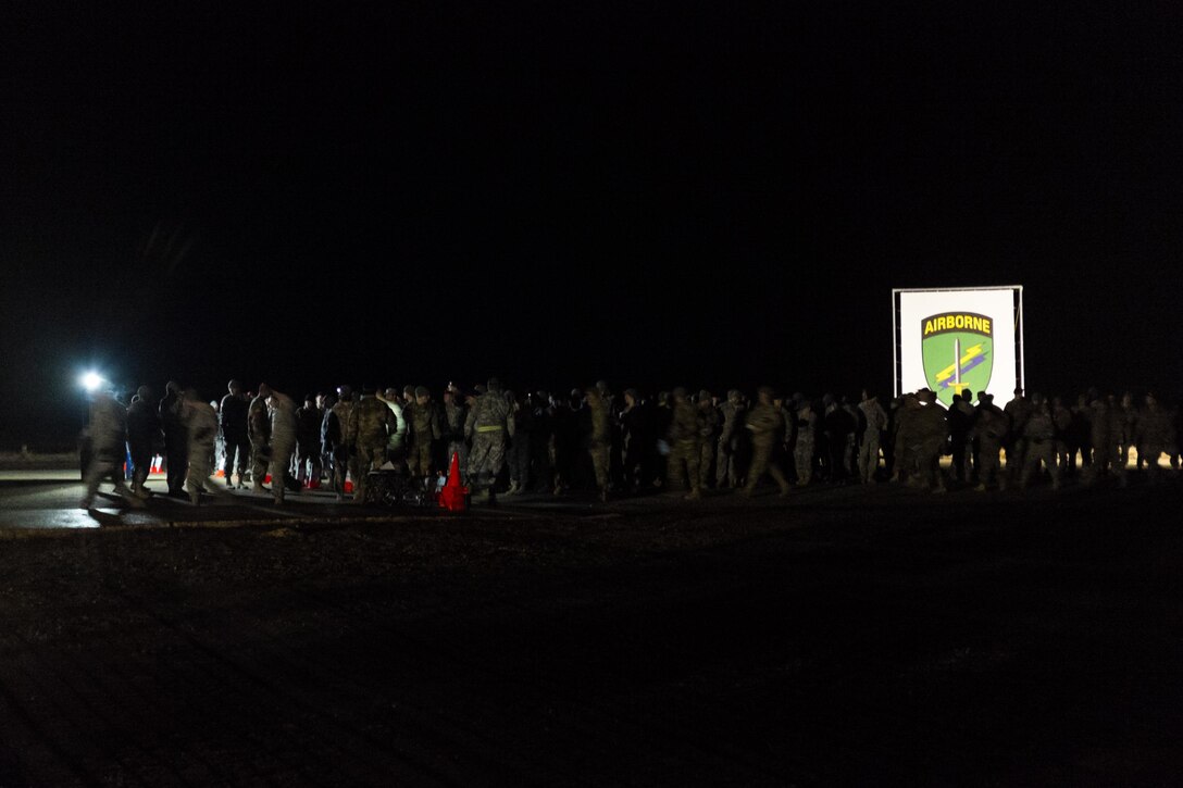 Army paratroopers manifest early in the morning at Sicily drop zone for the Randy Oler Memorial Operation Toy Drop on Fort Bragg, N.C., Dec. 5, 2015.  Operation Toy Drop is the world’s largest combined airborne operation in which soldiers help children around the world receive toys for the holidays. U.S. Army photo by Timothy L. Hale