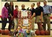 Members of the Faith Christian School’s women’s varsity basketball team pose in their gym in Summerville, South Carolina, for a photo displaying gifts received from a toy drive Dec. 17, 2015. The team’s coach, Nichelle Cunningham, master sergeant with the 315th Airlift Wing Judge Advocate, coordinated the donation, which was student inspired. These toys will go to service members’ families who are in need during the Christmas season by way of the 315th AW Family and Airman Readiness Office. (U.S. Air Force photo by Senior Airman Jonathan Lane)