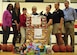 Members of the Faith Christian School’s women’s varsity basketball team pose in their gym in Summerville, South Carolina, for a photo displaying gifts received from a toy drive Dec. 17, 2015. The team’s coach, Nichelle Cunningham, master sergeant with the 315th Airlift Wing Judge Advocate, coordinated the donation, which was student inspired. These toys will go to service members’ families who are in need during the Christmas season by way of the 315th AW Family and Airman Readiness Office. (U.S. Air Force photo by Senior Airman Jonathan Lane)