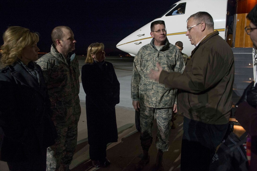 Deputy Defense Secretary Bob Work talks with members of an official party greeting him upon his arrival on Peterson Air Force Base, Colo., Dec. 16, 2015. DoD photo by Navy Petty Officer 1st Class Tim D. Godbee