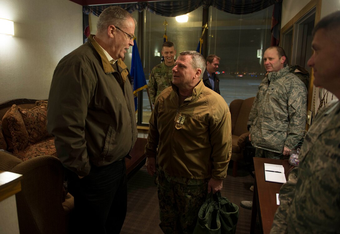 Deputy Defense Secretary Bob Work speaks with Navy Adm. William Gortney, commander of U.S. Northern Command, on Peterson Air Force Base, Colo., Dec. 16, 2015. DoD photo by Navy Petty Officer 1st Class Tim D. Godbee