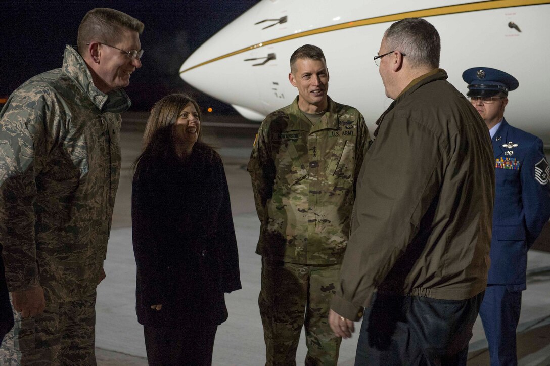 Members of an official party greet Deputy Defense Secretary Bob Work as he arrives on Peterson Air Force Base, Colo., Dec. 16, 2015. DoD photo by Navy Petty Officer 1st Class Tim D. Godbee