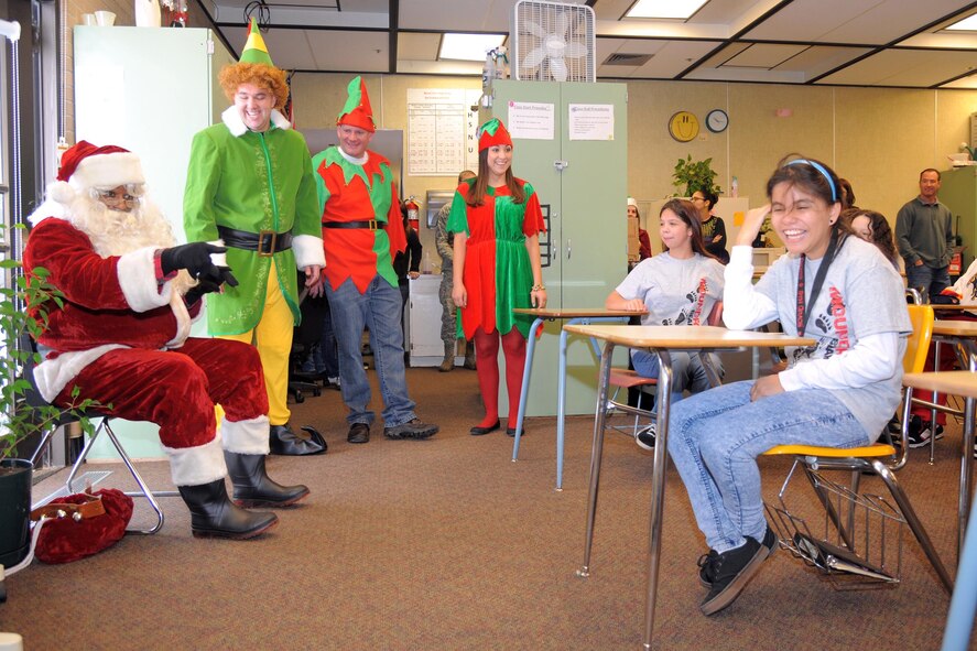 With help from reservists in the 419th Fighter Wing, Santa greets a group of students with special needs at Mound Fort Junior High in Ogden Dec. 16. (U.S. Air Force photo/Todd Cromar)