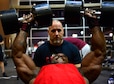Tech. Sgt. David, a 432nd Maintenance Group contract officer representative, performs chest-fly repetitions while his trainer, Derrick Chandler, motivates him during a workout Dec. 4, 2015, at Nellis Air Force Base, Nev. David recently attained his International Federation of Bodybuilding and Fitness professional card, which allows him to compete in professional bodybuilding competitions. (U.S. Air Force photo/Airman 1st Class Christian Clausen)