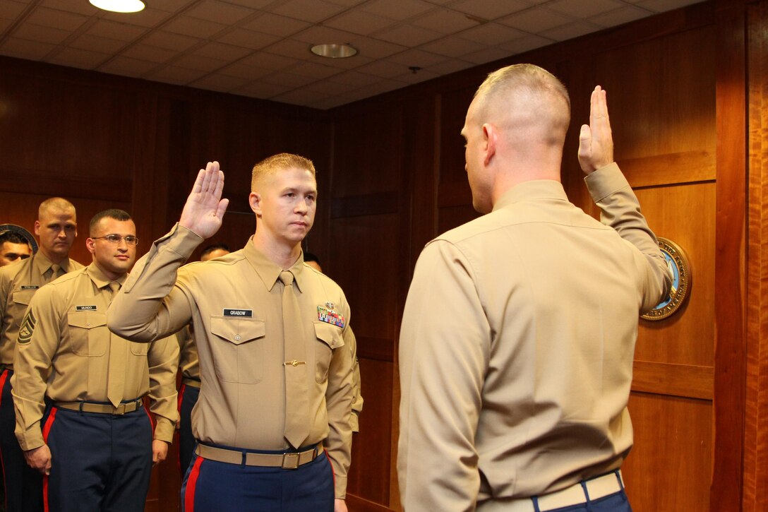 MOUNTAIN VIEW, Calif. - Gunnery Sgt.Adam Grabow, the Station Commander of Recruiting Sub-Station Santa Rosa, reaffirms his commitment to the Marine Corps aboard the Recruiting Station San Francisco Headquarters, Dec. 10, 2015.