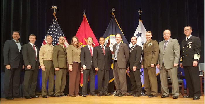 Members of Marine Corps Systems Command received the Innovation Excellence Acquisition Team of the Year award during a ceremony Nov. 17 at the Pentagon. (From left) James Smerchansky, MCSC executive director; Sean J. Stackley, assistant secretary of the Navy for Research, Development and Acquisition; Brig. Gen. Joseph Shrader, MCSC commander;  Capt. Jeramiah Lujan, Jane Bachman, John Raisbeck, Luis E. Velazquez, Tyson Kackley, Alexander Solomon, Maj James Reynolds, Mike O’Neal; and Adm. John Richardson, chief of Naval Operations. (U.S. Navy photo by Steven Vozzola)