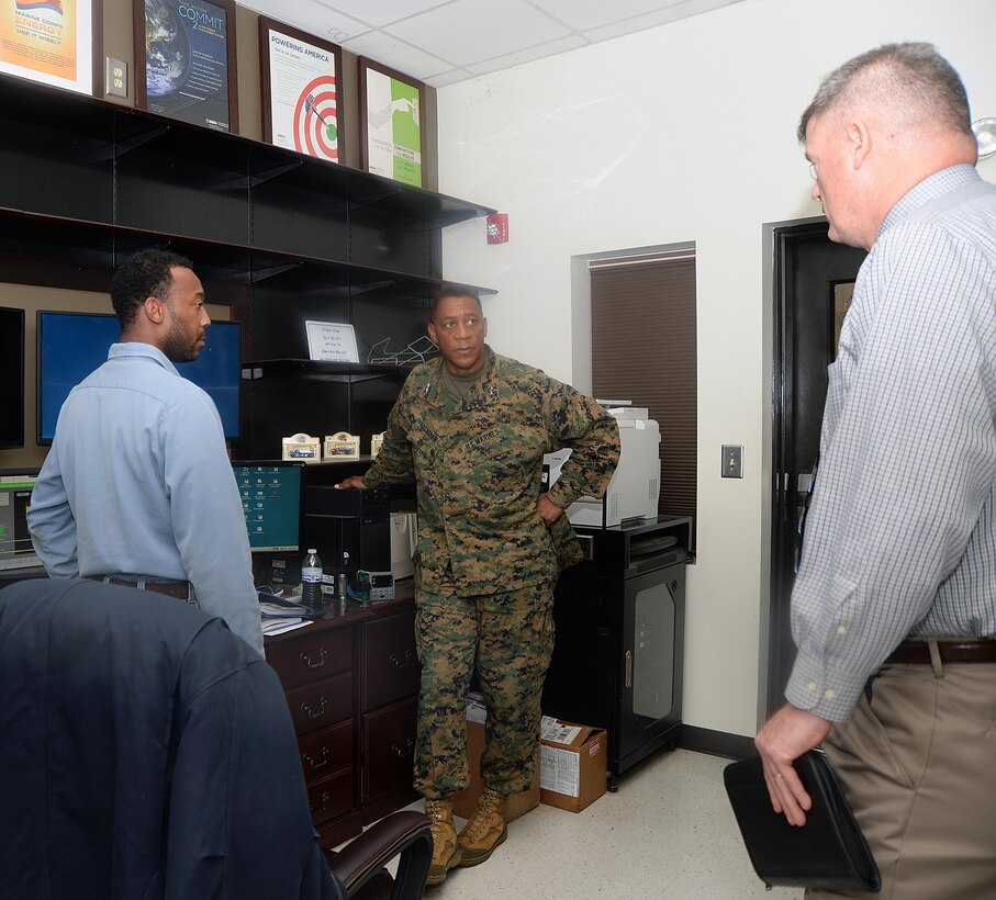 Fred Broome, director, Installation and Environmental Division, Marine Corps Logistics Base Albany, explains the landfill gas generator program during a tour, Dec. 16.
