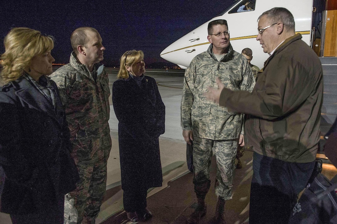 Deputy Defense Secretary Bob Work talks with military members as he arrives on Peterson Air Force Base, Colo., Dec. 16, 2015. Work is in Colorado to meet with leaders and tour local commands. DoD photo by Navy Petty Officer 1st Class Tim D. Godbee