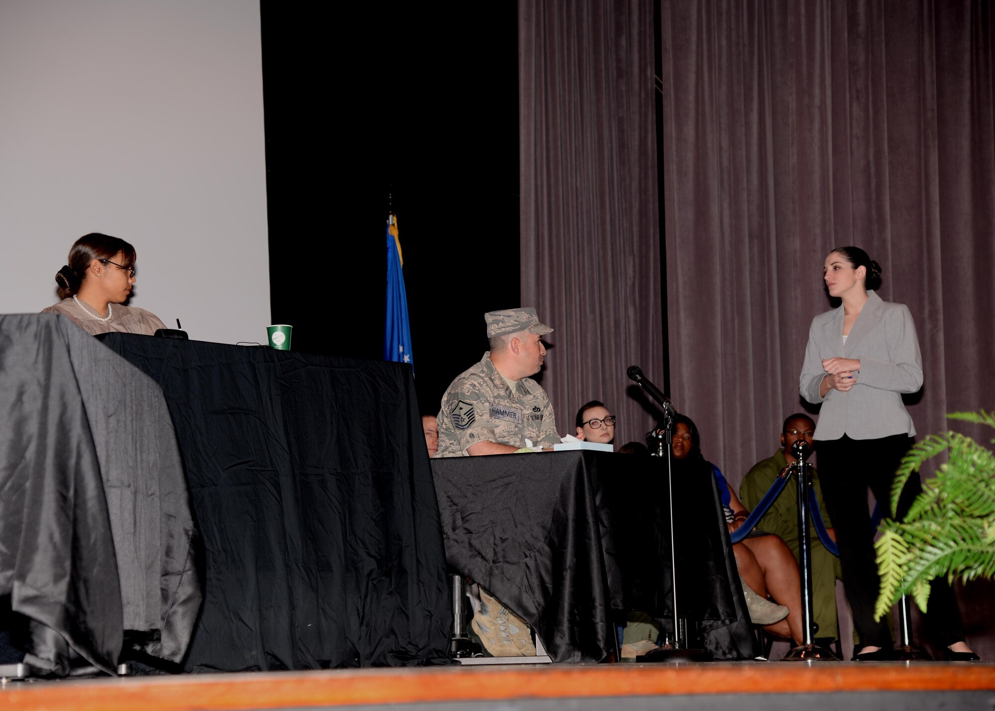 The defense attorney, played by Senior Airman Kathleen Greene, questions First Sergeant Hammer, played by Master Sgt. Noe Torres, as part of a skit titled “You don’t know Jack like I know Jack,” Dec. 10 in the Kaye Auditorium at Columbus Air Force Base, Mississippi. The skit detailed the criminal case of the fictional Senior Airman Jack Daniels, an Airman who stood accused of killing one and injuring another while driving under the influence of alcohol. (U.S. Air Force photo/Airman 1st Class John Day)