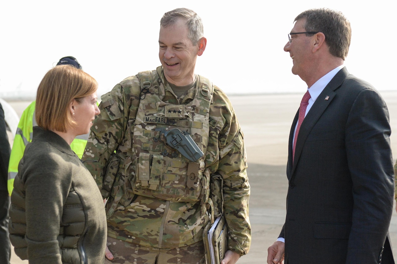 U.S. Army Lt. Gen. Sean MacFarland greets U.S. Defense Secretary Ash Carter and his wife, Stephanie, after they arrive in Baghdad, Dec. 16, 2015. DoD photo by Army Sgt. 1st Class Clydell Kinchen