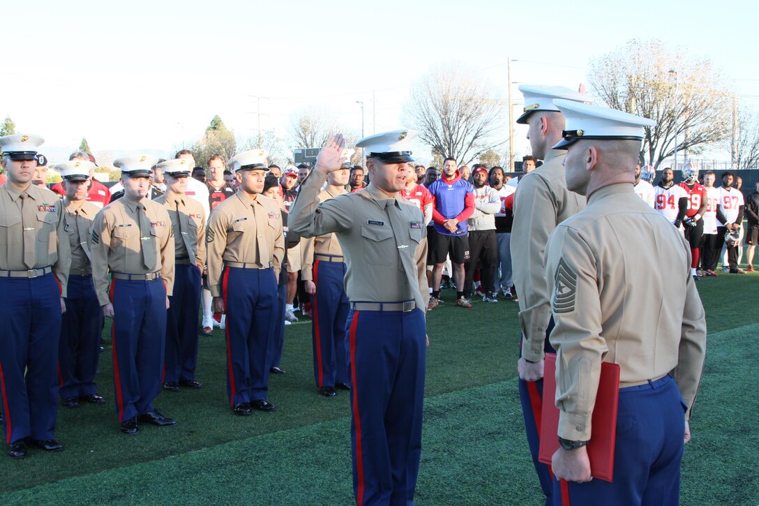 SANTA CLARA, Calif. - Staff Sergeant Rudy Castillo reaffirmed his commitment to the Marine Corps during a special ceremony after the San Francisco 49ers' practice aboard the 49ers Practice Facility, Dec. 16, 2015.  Our San Francisco Marines spent a day touring the Levi's Stadium, and meeting 49ers football players after their practice.