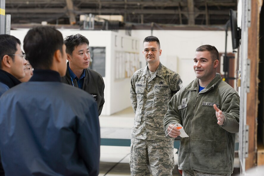 Japan Maritime Self-Defense Force members of the 4 Maintenance Squadron listen to Master Sgt. Aaron Ross, 374th Maintenance Squadron isochronal inspection dock chief, during a facility tour at Yokota Air Base, Japan, Dec. 11, 2015. Ross explained the labeling process that is used during an isochronal inspection, allowing maintainers to visibly see what sections of the inspection have been completed and which are waiting to be completed; both electronic and physical. (U.S. Air Force photo by Staff Sgt. Cody H. Ramirez/Released)
12/16/2015 - Japan Maritime Self-Defense Force members watch an isochronal inspection conducted at Yokota Air Base, Japan, Dec. 11, 2015. The JMSDF members were engine and electrician maintainers with the 4 Maintenance Squadron from Atsugi Air Base, Japan. (U.S. Air Force photo by Staff Sgt. Cody H. Ramirez/Released)
12/16/2015 - Japan Maritime Self-Defense Force Petty Officer 2nd Class Takeshi Murai, 4 Maintenance Squadron, inspects the part of a C-130 Hercules engine during a facility tour at Yokota Air Base, Japan, Dec. 11, 2015. Nine JMSDF members visited Yokota to learn about C-130 Hercules maintenance conducted at Yokota. (U.S. Air Force photo by Staff Sgt. Cody H. Ramirez/Released)
12/16/2015 - Japan Maritime Self-Defense Force Petty Officer 2nd Class Takeshi Murai, 4 Maintenance Squadron, inspects a C-130 Hercules engine during a facility tour at Yokota Air Base, Japan, Dec. 11, 2015. The JMSDF maintainers compared the maintenance conducted at Yokota to their own to help improve processes and efficiency. (U.S. Air Force photo by Staff Sgt. Cody H. Ramirez/Released)
12/16/2015 - Tech. Sgt. Jeff De Remer, 374th Maintenance Squadron repair and reclamation section chief, explains specifics regarding Yokota's C-130 Hercules maintenance to members of the Japan Maritime Self-Defense Force at Yokota Air Base, Japan, Dec. 11, 2015. Members with the 374th Maintenance Group discussed maintenance with the JSMDF members and gave them tours of 