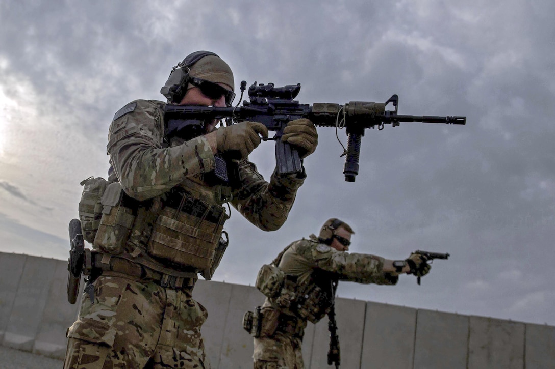 U.S. service members zero-in their weapons at a range near Kabul, Afghanistan, Dec. 8, 2015. U.S. Air Force photo by Staff Sgt. Corey Hook