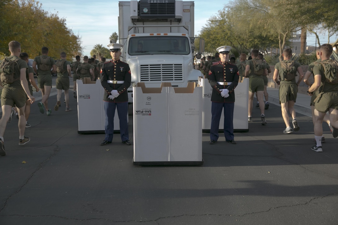 Marine Corps Communication-Electronic School Marines collect toys during a Toys for Tots Fun Run aboard the Combat Center, Dec. 9, 2015. More than 2,000 participants purchased and ran with toys to donate to the U.S. Marine Corps Toys for Tots Program. (Official Marine Corps photo by Lance Cpl. Levi Schultz/Released)