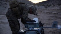 Lance Cpl. Travis DeShazo, a rifleman assigned to Company E, 2nd Battalion, 4th Marine Regiment, 1st Marine Division, assembles a Raven unmanned aerial system to establish the location of notional enemy units aboard Marine Corps Air Ground Combat Center, California, Dec. 10, 2015. The Marines employed the Raven UAS as part of Steel Knight to gain a better understanding of it and develop a higher proficiency of what it takes to operate as a more effective as the ground combat element of the I Marine Expeditionary Force. 