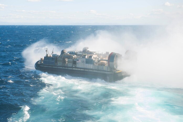 A Landing Craft Air Cushion assigned to Assault Craft Unit 5, departs the well deck of amphibious assault ship USS Boxer during an amphibious assault exercise. The Boxer Amphibious Ready Group is underway off the coast of Southern California completing a certification exercise in the Pacific Ocean, Dec 14, 2015. CERTEX is the final evaluation of the 13th Marine Expeditionary Unit and Boxer ARG prior to deployment and is intended to certify their readiness to conduct integrated missions across the full spectrum of military operations. U. S. Navy photo by Petty Officer 3rd Class Michael T. Eckelbecker
