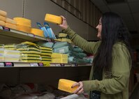 An Base Supply Center employee restocks sponges at the Base Supply Center at Luke Air Force Base, Ariz., Dec. 17, 2015. BSC employees are trained to accomplish warehousing, merchandising and housekeeping duties, in addition to operating computerized cash registers and providing customer assistance. (U.S. Air Force photo by Senior Airman Devante Williams 