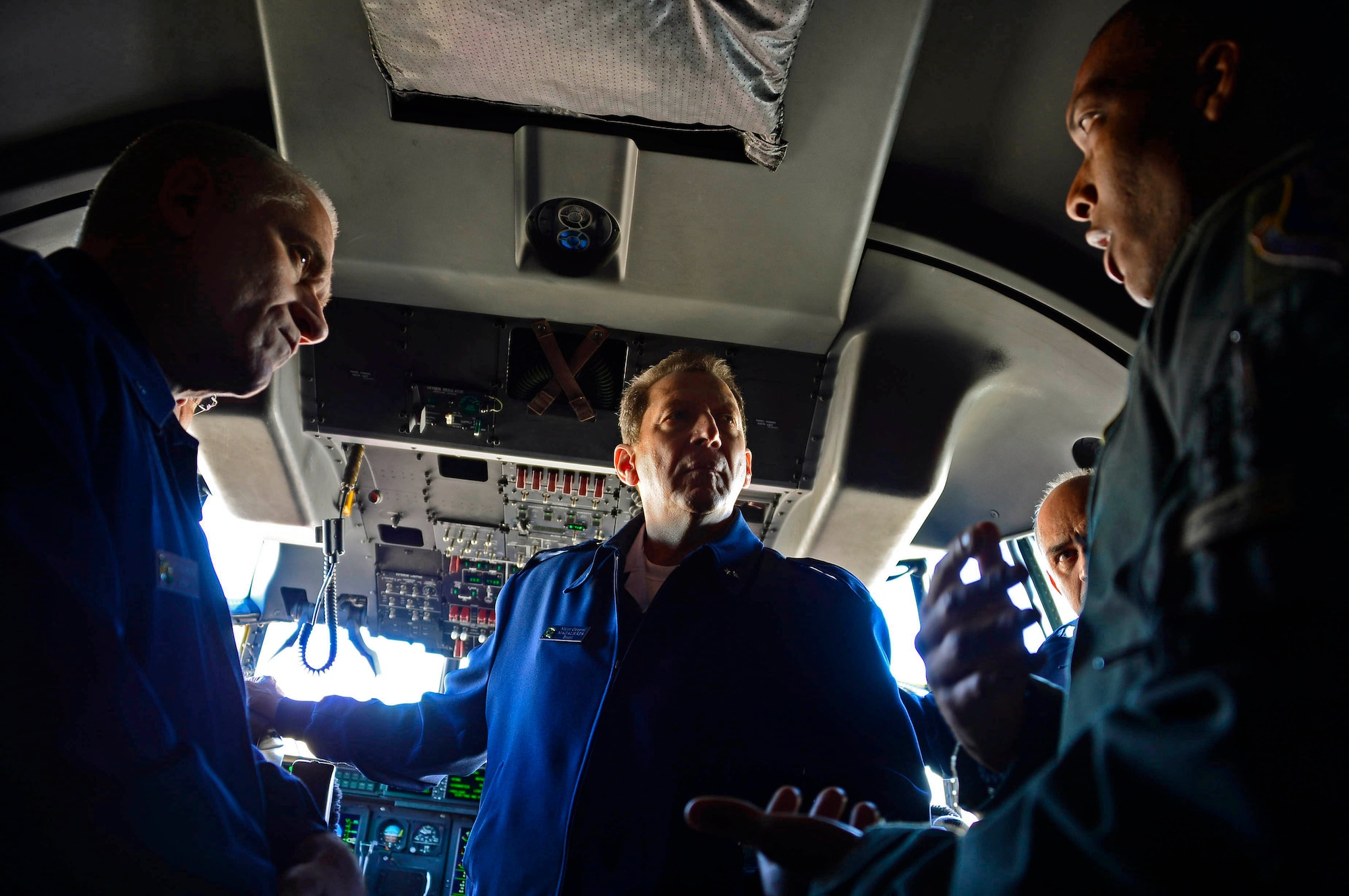 U.S. Air Force Capt. Garrett Sinclair, mobility officer assigned to the 79th Rescue Squadron, briefs Suboficial Márcio Cardoso Maia, Assistant to the Air Attaché, Brazilian Air Force Maj. Gen. Ricardo Pucci Magalhães, Air Attaché to the United States of America and Canada, and Brazilian Air Force Lt. Gen. Mauricio Ribeiro Gonçalves, Director General of the Secretariat of the Inter-American Defense Board, on the personnel recovery capabilities of the HC-130J Combat King II during the tour portion of the Inter-American Defense Board and Brazilian Air Force Air Attaché visit to 12th Air Force (Air Forces Southern), Davis-Monthan AFB, Ariz., Dec. 16, 2015.  As part of U.S. Southern Command, 12th AF (AFSOUTH) is dedicated to building and maintaining relationships with U.S. partner nations throughout the Central and South America area of responsibility.  Engagements like the Inter-American Defense Board and Brazilian Air Force Air Attaché visit, provides an opportunity for U.S. partner nations to gain first-hand experience and knowledge about U.S. capabilities. (U.S. Air Force photo by Tech. Sgt. Heather R. Redman/Released)