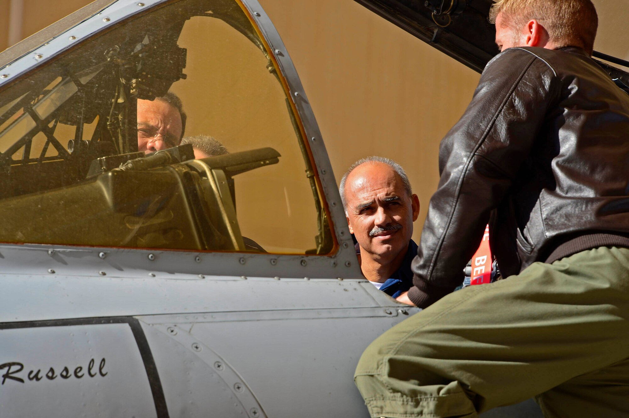U.S. Air Force Capt. Dustin Merritt, assistant weapons and tatics cheif assigned to 355th Operations Support Squadron,  briefs Brazilian Air Force Maj. Gen. Ricardo Pucci Magalhães, Air Attaché to the United States of America and Canada, Brazilian Air Force Maj. Gen. Osmar Lootens Machado, Chief of Brazil’s Representation in the Inter-American Defense Board, and Brazilian Air Force Lt. Gen. Mauricio Ribeiro Gonçalves, Director General of the Secretariat of the Inter-American Defense Board, on the capabilities of the A-10 Thunderbolt during the tour portion of the Inter-American Defense Board and Brazilian Air Force Air Attaché visit to 12th Air Force (Air Forces Southern), Davis-Monthan AFB, Ariz., Dec. 16, 2015.  As part of U.S. Southern Command, 12th AF (AFSOUTH) is dedicated to building and maintaining relationships with U.S. partner nations throughout the Central and South America area of responsibility.  Engagements like the Inter-American Defense Board and Brazilian Air Force Air Attaché visit, provides an opportunity for U.S. partner nations to gain first-hand experience and knowledge about U.S. capabilities. (U.S. Air Force photo by Tech. Sgt. Heather R. Redman/Released)