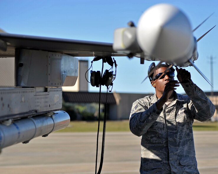 A 77th Aircraft Maintenance Unit aircraft armament member from Shaw Air Force Base, S.C. performs maintenance on a training missile Dec. 15 at the Tyndall AFB, Fla., flightline. Airmen from Shaw came to Tyndall for the 53rd’s Weapons Evaluation Group Weapons System Evaluation Program and The Checkered Flag 16-1 exercise. (U.S. Air Force photo by Senior Airman Sergio A. Gamboa/Released)
