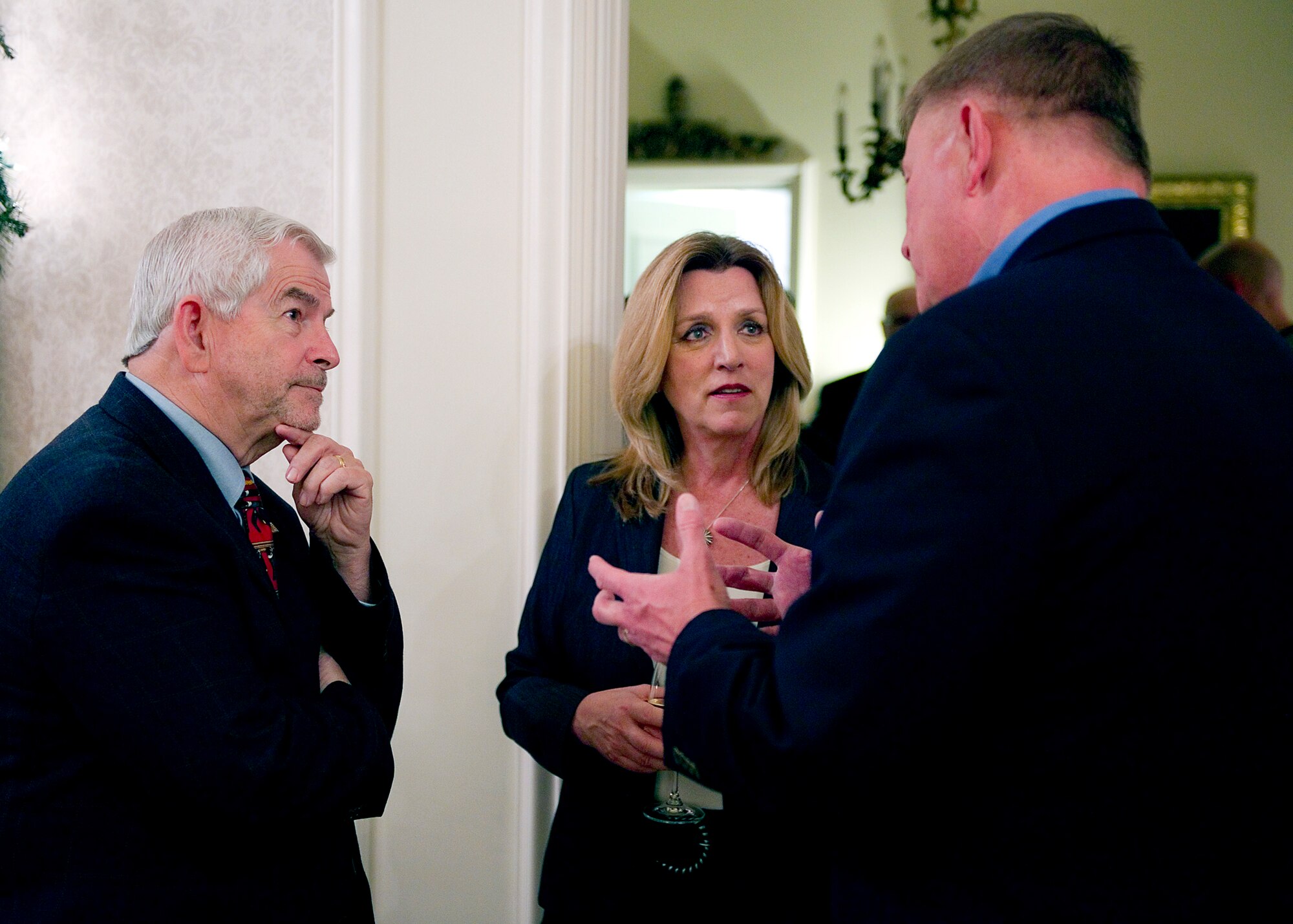 Col. Douglas Schwartz, 434th Air Refueling Wing commander (right), discusses the impact of Grissom's refueling mission wit Secretary of the Air Force Deborah Lee James and Haj Job, 434th ARW honorary commander, at the Honeywell House, Wabash Ind., Dec. 16, 2015. During James' two-day visit to the Hoosier Wing, she met with Airmen and civic leaders. (U.S. Air Force photo/Tech. Sgt. Benjamin Mota)