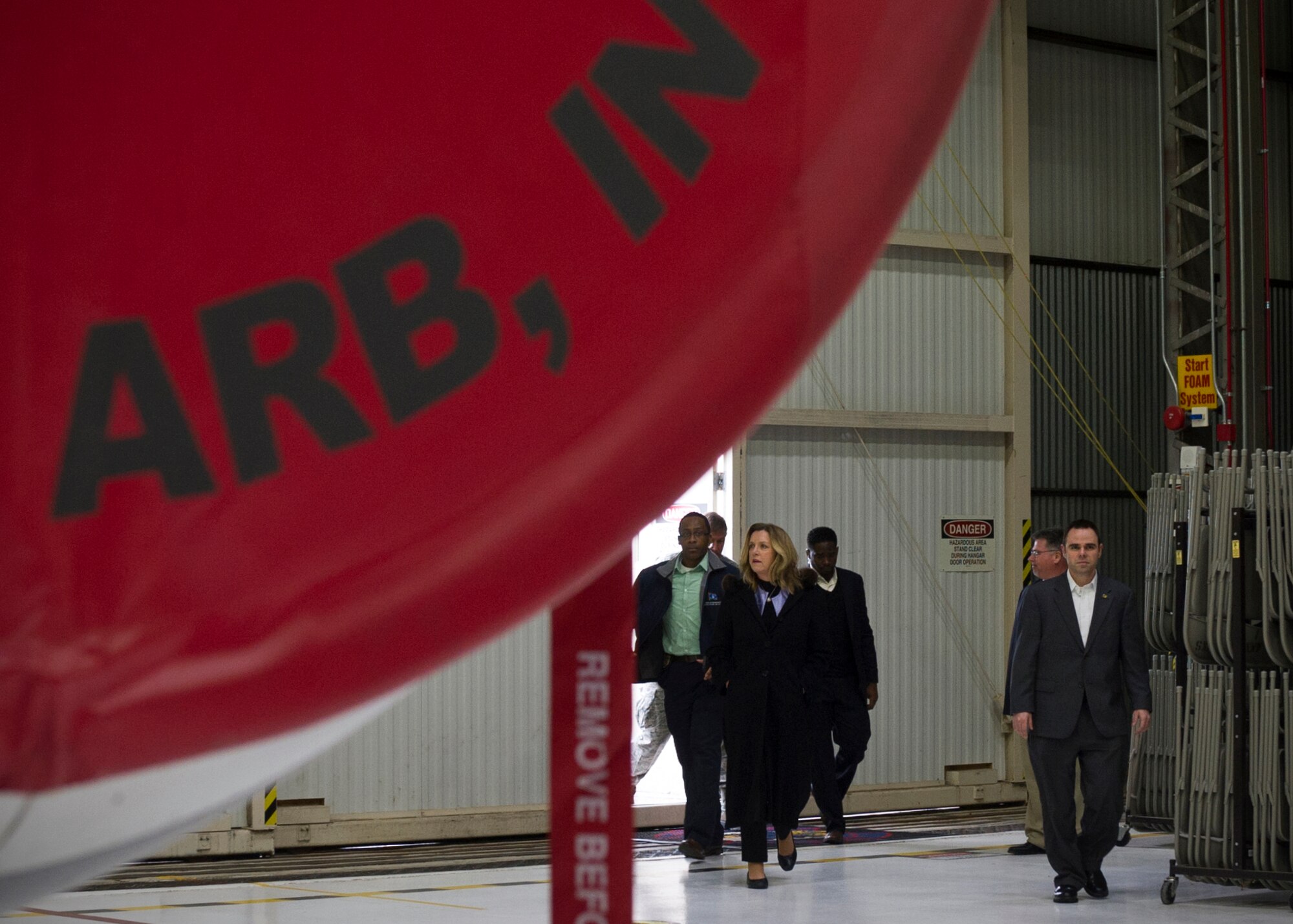 Secretary of the Air Force Deborah Lee James enters Dock 1 at the start of tour of a KC-135R Stratotanker at Grissom Air Reserve Base, Ind., Dec. 16, 2015. During James' two-day visit to the base, she had the opportunity to meet with Airmen and civic leaders alike.  (U.S. Air Force photo/Senior Airman Katrina Heikkinen)