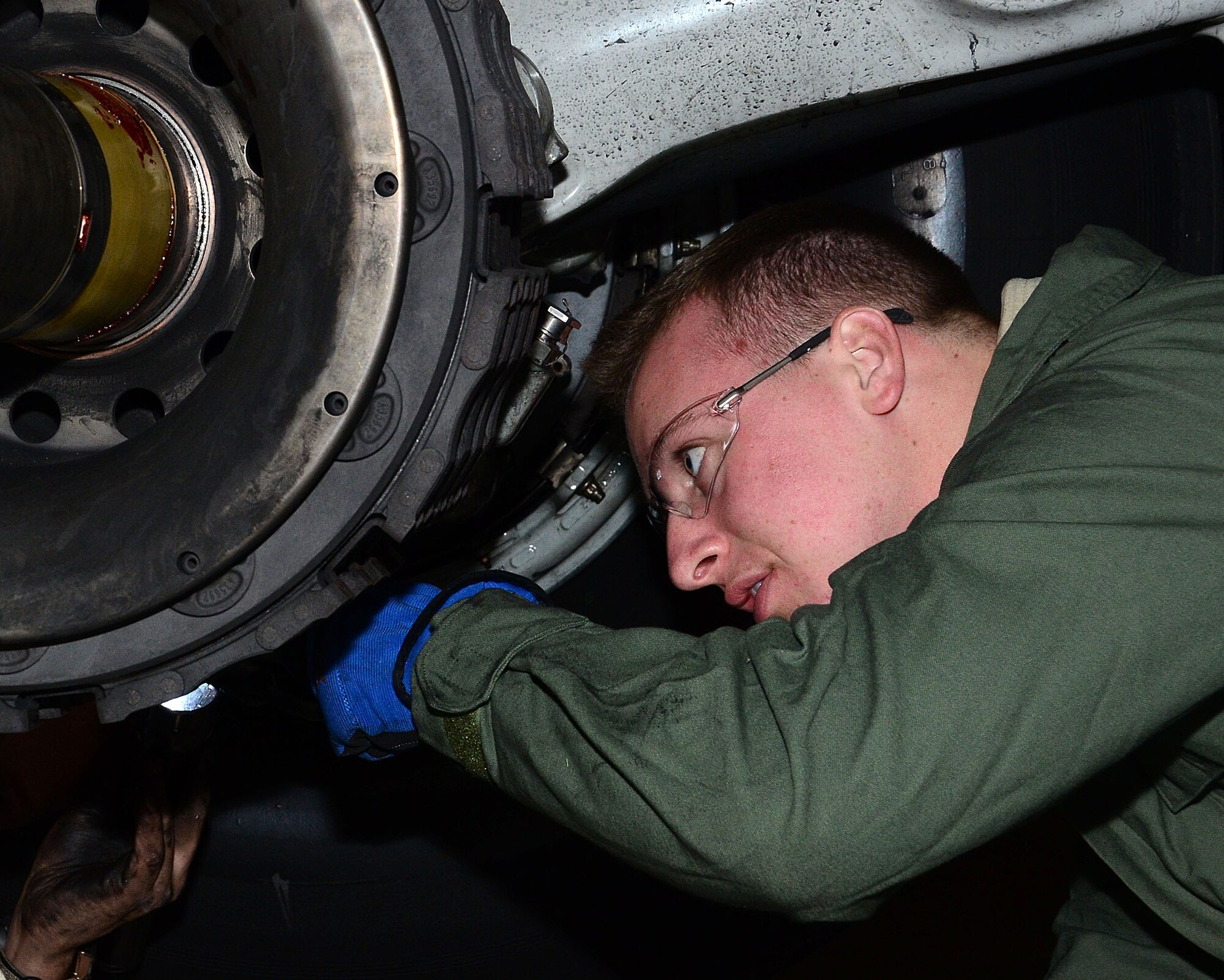 WRIGHT-PATTERSON AIR FORCE BASE, Ohio – Staff Sgt. Brandon Wish, 445th Aircraft Maintenance Squadron crew chief, is performing a brake stack change for a worn out brake system on a 445th Airlift Wing C-17 Globemaster III Dec. 6, 2015. (U.S. Air Force photo/Senior Airman Joel McCullough)