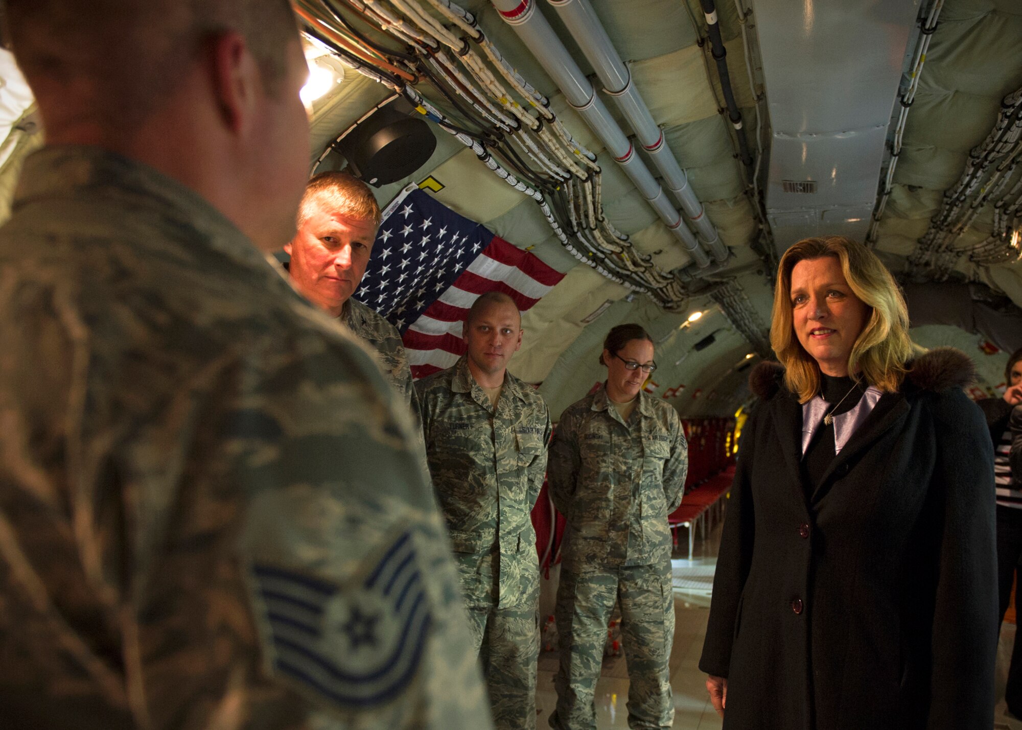 Secretary of the Air Force Deborah Lee James and Col. Doug Schwartz, 434th Air Refueling Wing commander, listen as Tech. Sgt. Ben Bond, 434th Aircraft Maintenance Squadron crew chief, explains his Air Force generational background during a KC-135R Stratotanker tour at Grissom Air Reserve Base, Ind., Dec. 16, 2015. As part of her two-day visit, James had the opportunity to meet with Grissom Airmen and witnessed first-hand the Hoosier Wing's air refueling mission. (U.S. Air Force photo/Senior Airman Katrina Heikkinen)