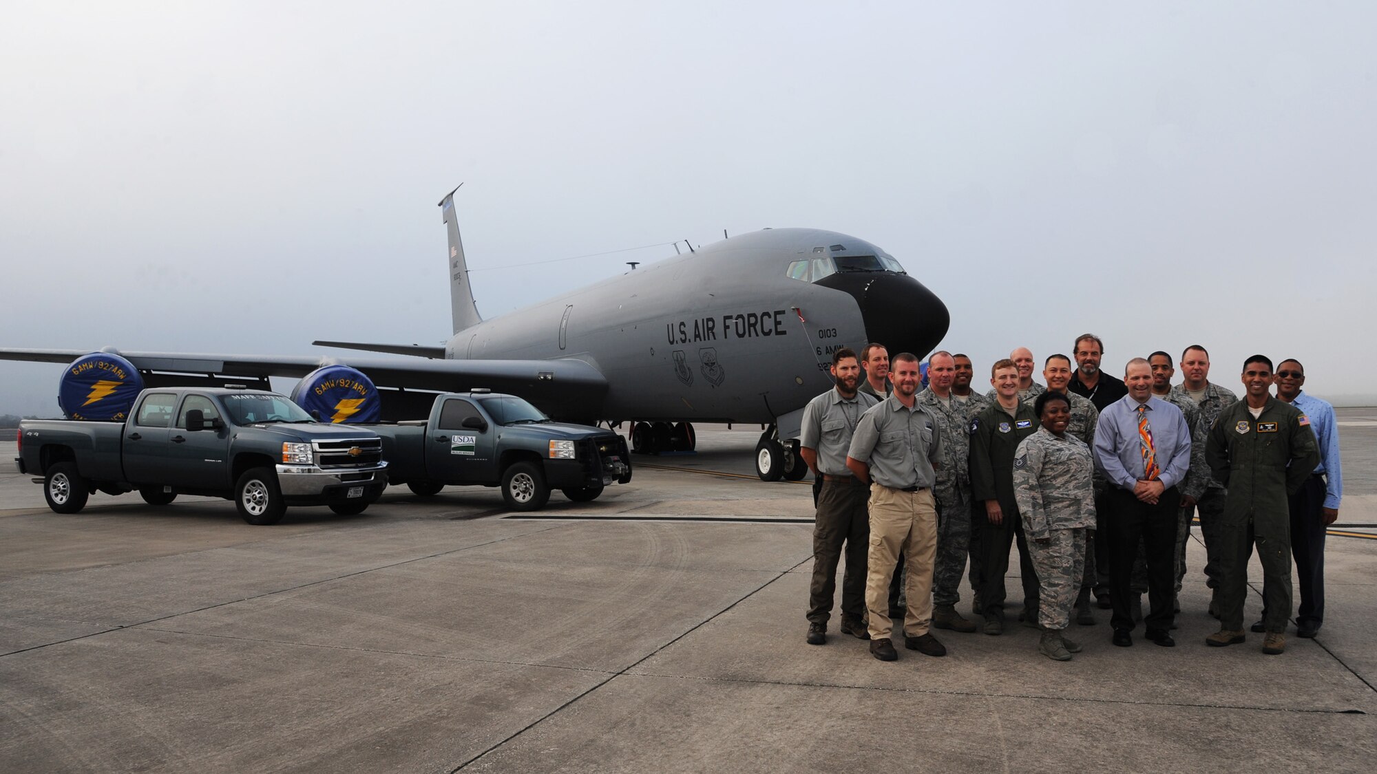 Members of the 6th Air Mobility Wing Safety Office pose for a photo in front of a KC-135 Stratotanker and safety vehicles at MacDill Air Force Base, Fla., Dec. 17, 2015. The office earned the 2015 Air Mobility Command Safety Office of the Year award. (U.S. Air Force photo by Senior Airman Danielle Quilla)