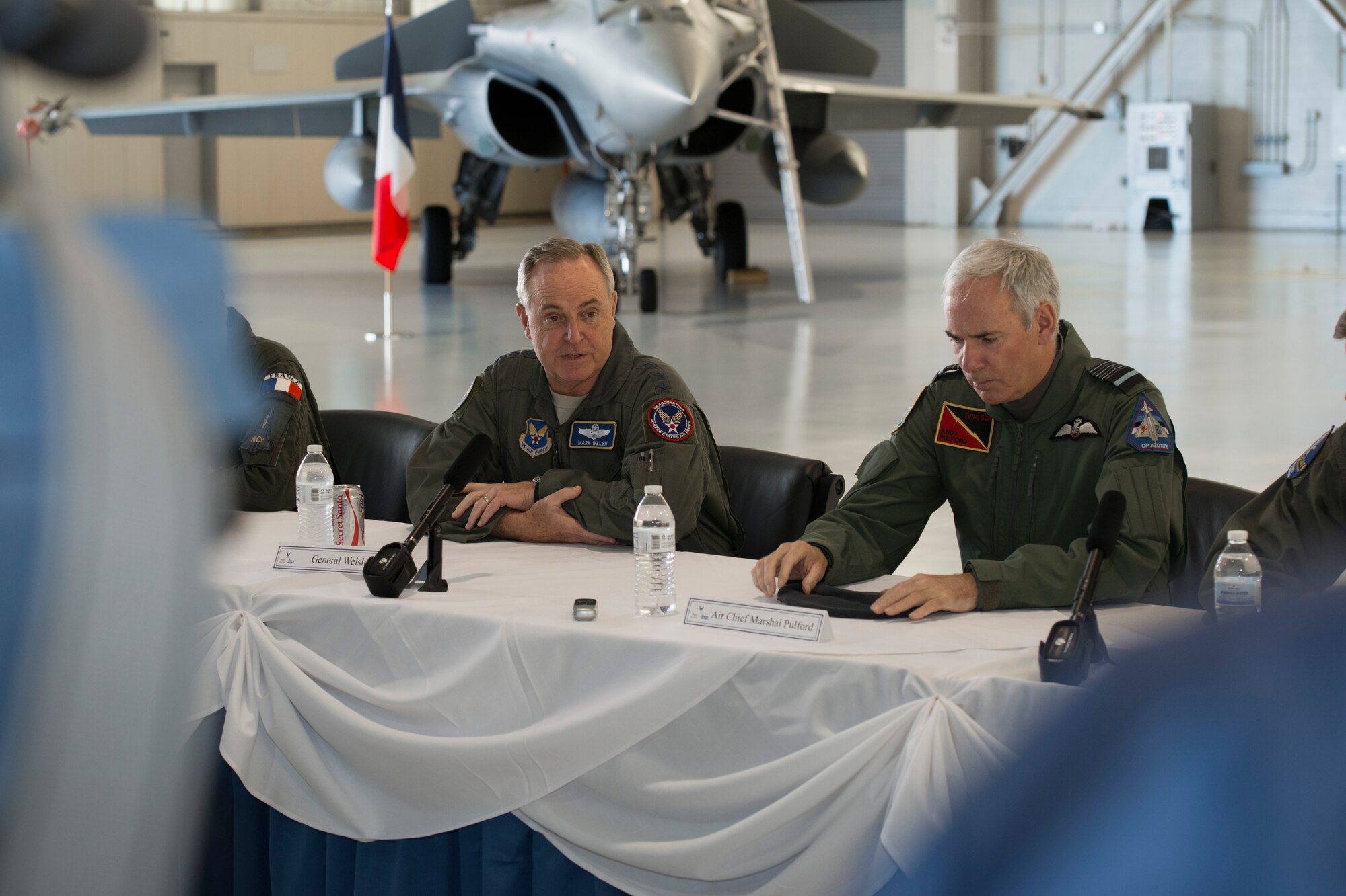 Chief of Staff of the U.S. Air Force Gen. Mark A. Welsh III and British Royal Air Force Chief of the Air Staff, Air Chief Marshall Sir Andrew Pulford answer questions during a press conference hosted during the Trilateral Exercise at Langley Air Force Base, Va., Dec. 15, 2015.  The exercise, which aims to give coalition forces an opportunity to hone skills during simulated adversarial scenarios, kicked off Dec. 2, 2015 and is scheduled to conclude Dec. 18, 2015. (U.S. Air Force photo by Tech. Sgt. Katie Gar Ward)
