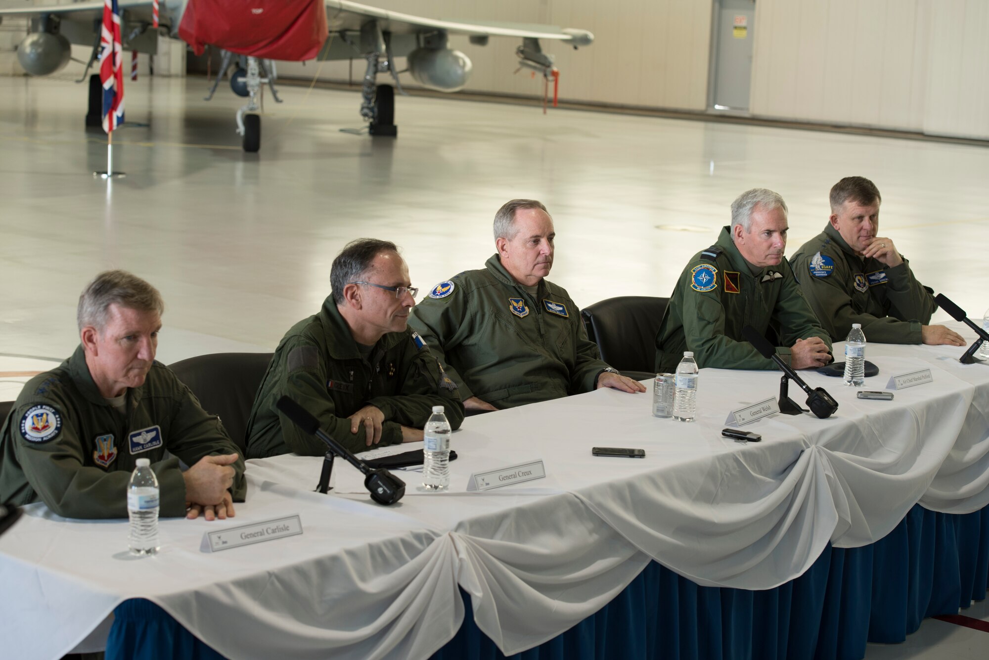 From left, U.S. Air Force Gen. Hawk Carlisle, commander of Air Combat Command, French air force Deputy Chief of the Air Staff Gen. Antoine Creux, Chief of Staff of the U.S. Air Force Gen. Mark A. Welsh III, British Royal Air Force Chief of the Air Staff, Air Chief Marshall Sir Andrew Pulford, and U.S. Air Force Gen. Frank Gorenc, commander of U.S. Air Forces in Europe (USAFE), answer questions during a press conference hosted during the Trilateral Exercise at Langley Air Force Base, Va., Dec. 15, 2015.  As part of the exercise, Pulford, Welsh, Creux and Gorenc hosted a press conference to discuss the importance of working together as coalition forces.  (U.S. Air Force photo by Tech. Sgt. Katie Gar Ward)